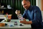LEGO Game Boy 72046 builder holding completed model