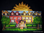 Textured Sculptamold relief sculpture of colorful houses, green trees, and a golden sun against a black background.
