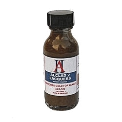 Alclad II mirrored gold paint for Lexan in a 1 oz bottle with label detailing product information